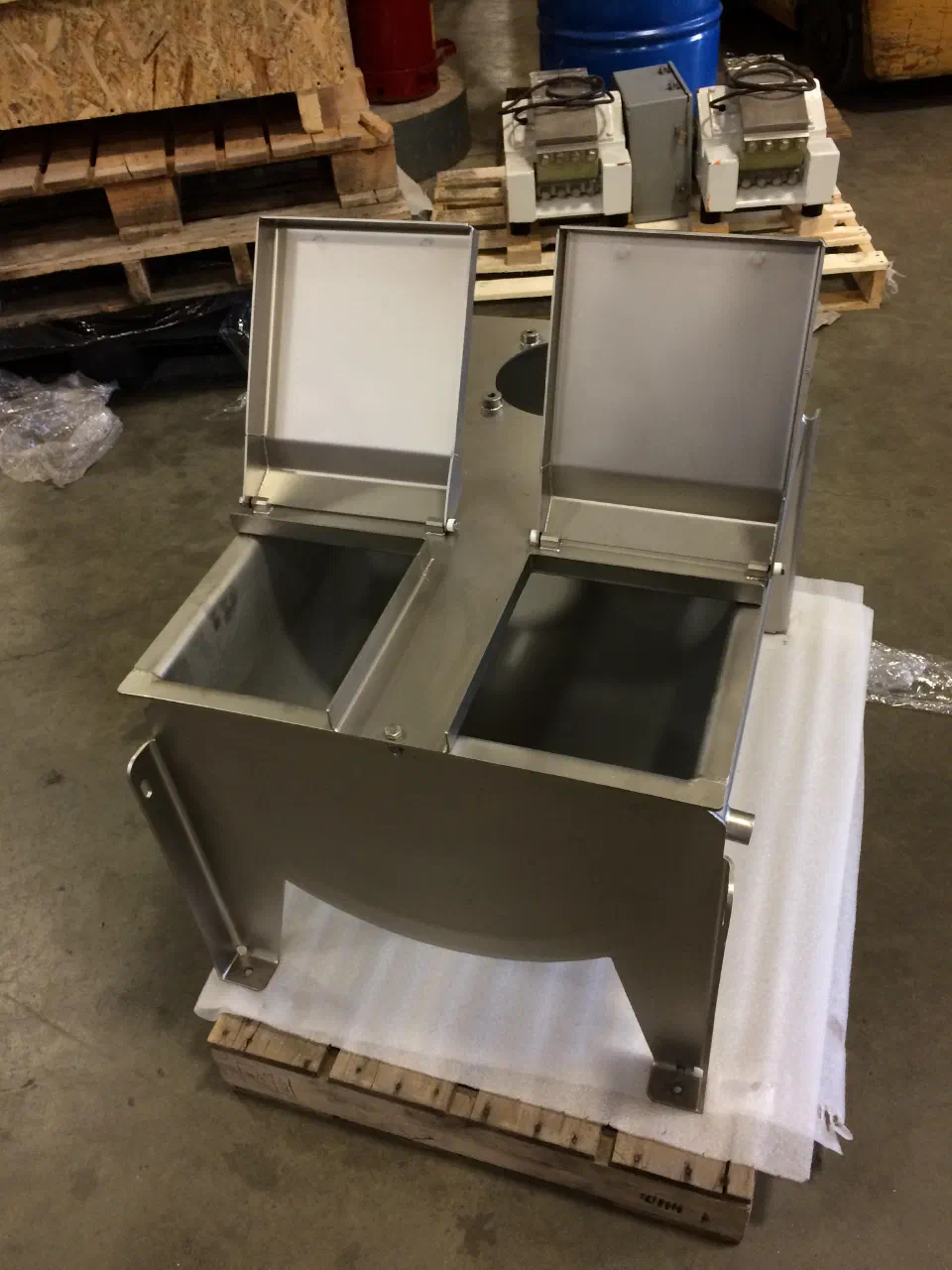 The surge tank and funnel weldment before assembly