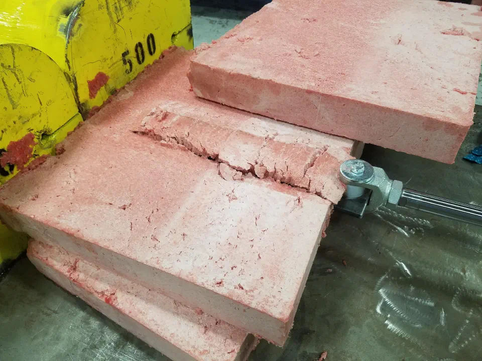 A block split during testing. The pneumatic test rig lurched when it gave way, which is why the machine became hydraulic