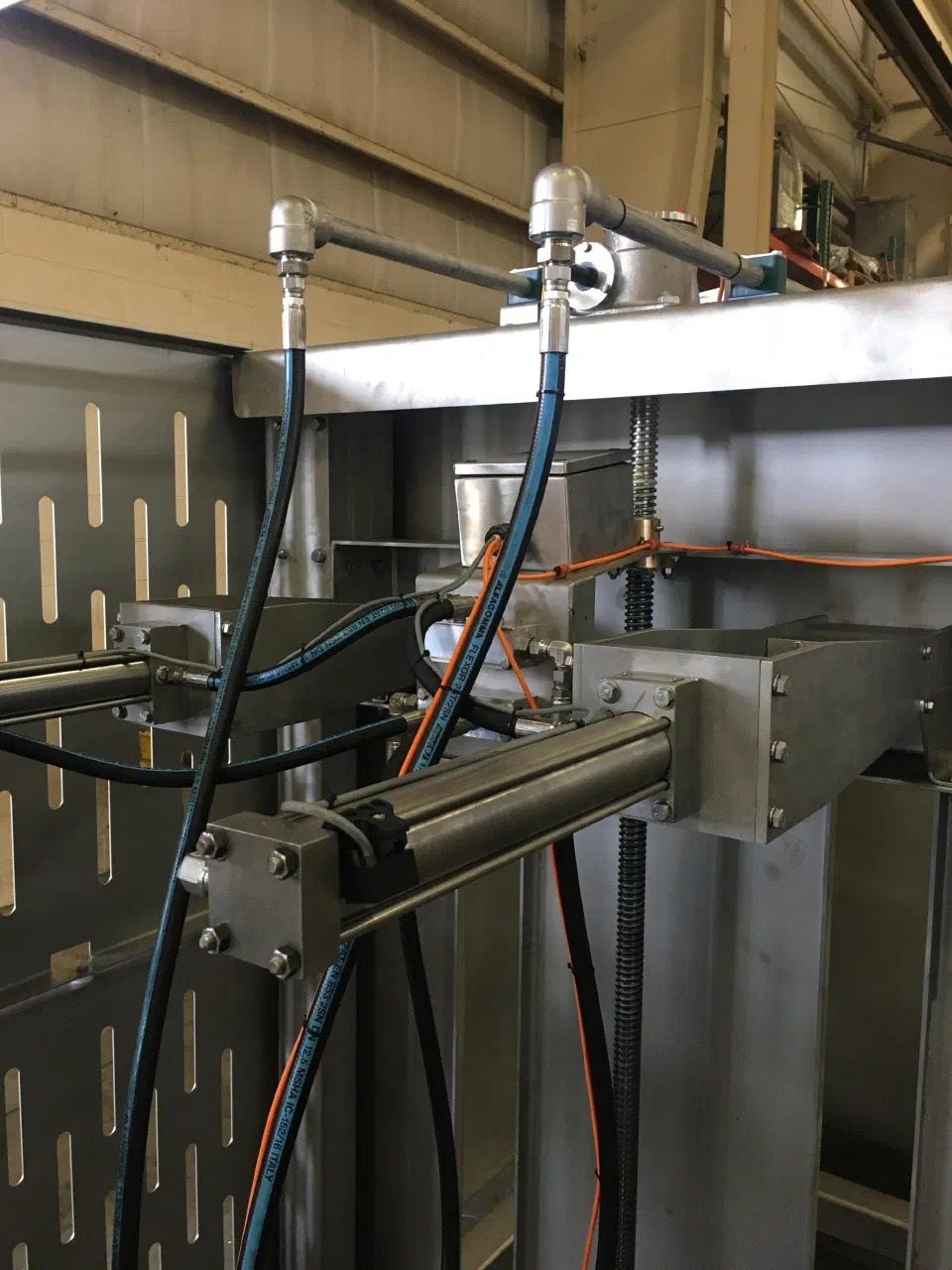 A hydraulic cylinder and hose routing on the second-generation machine