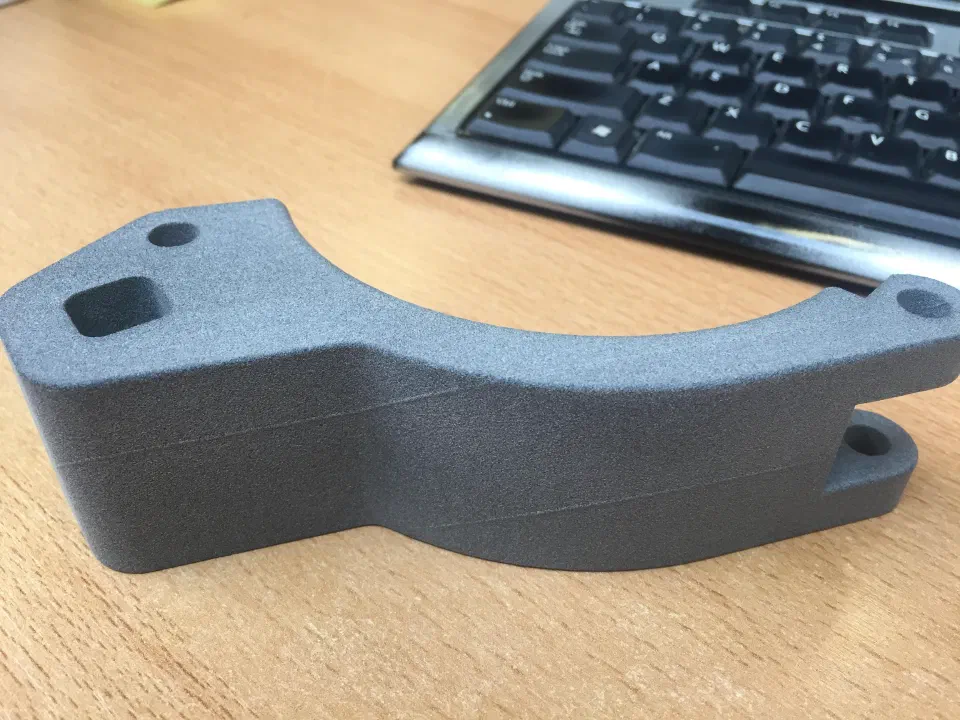 A 3D-printed validation clamp, used to prove the grip before machining production parts