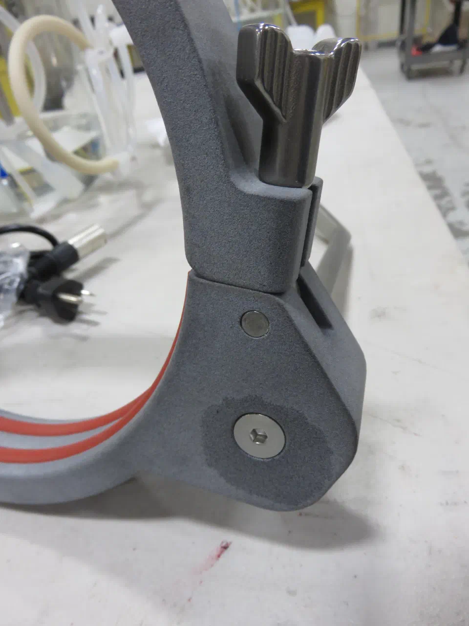 The integrated hinge and wing-nut latch, which replaced a purchased hinge that was hard to clean