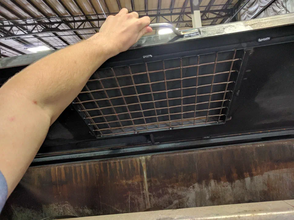 The grated filling hatch in the lid