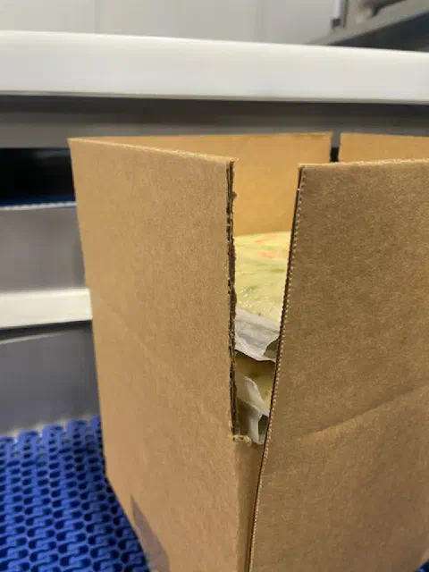A case torn by oversized product, which led to a warning added to the scope