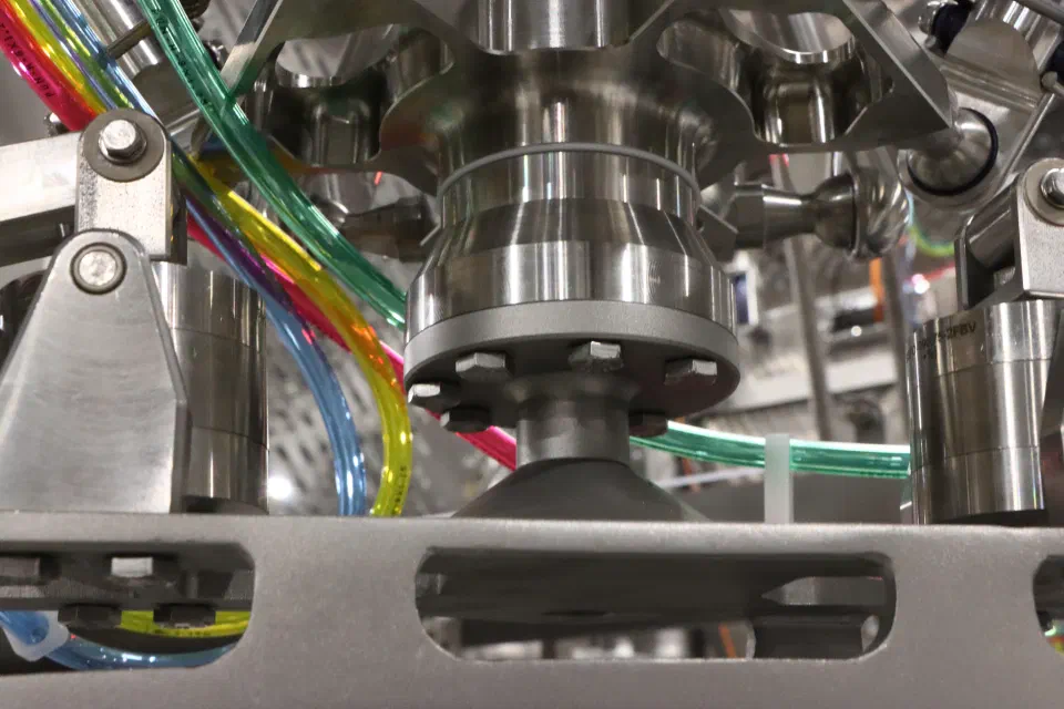 Close-up of the robot's tool mount and vacuum cup hardware