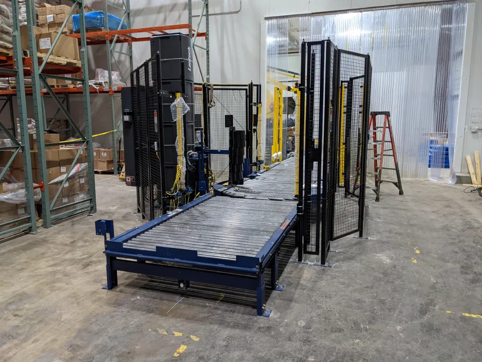 The stretch wrapper being installed at the end of the line