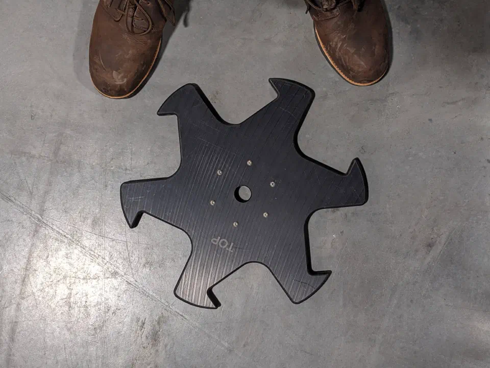A star wheel prototype for turning 64 oz bottles, redesigned in-house