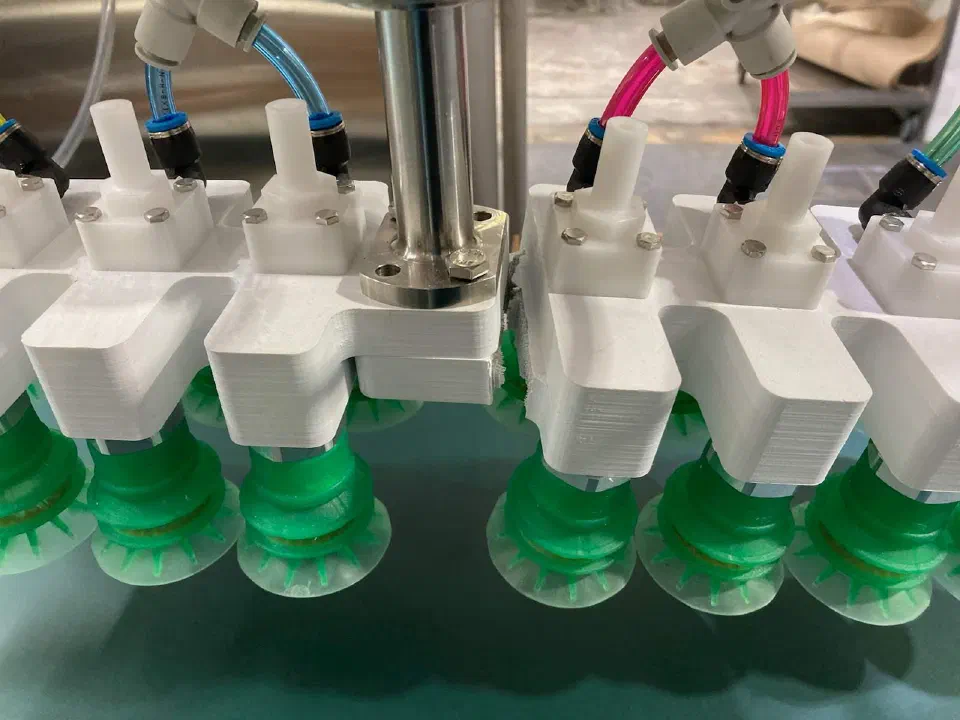 The finished multi-cup vacuum tool on the robot