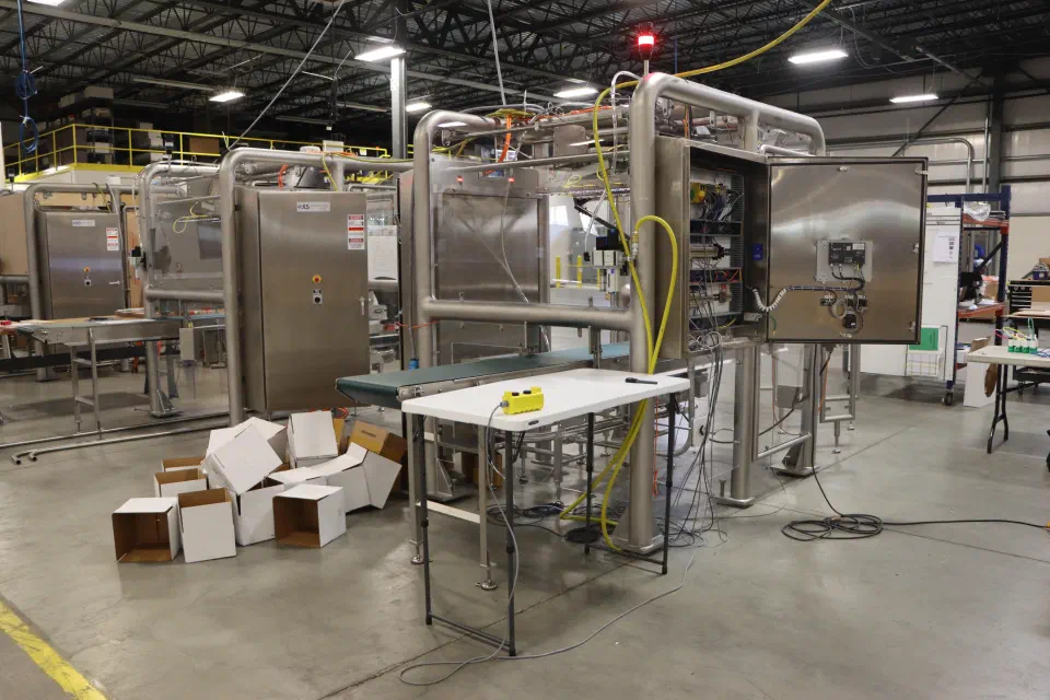 A cell mid-build with its electrical cabinet open