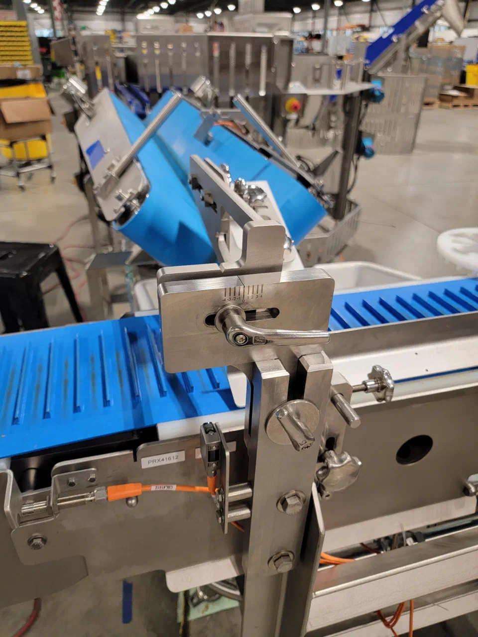 The flighted collation conveyor and adjustable guides during factory acceptance testing