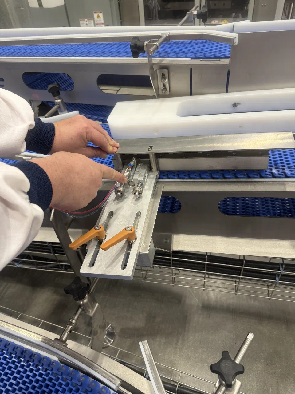 Adjusting the pneumatic stop assembly during a service visit