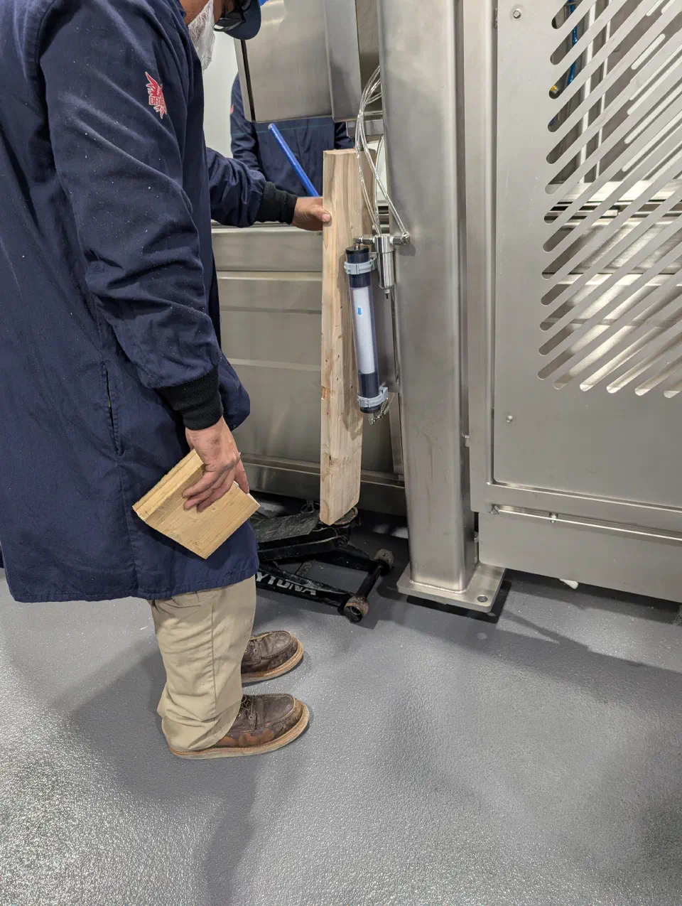 Leveling a frame section during installation at the customer's plant