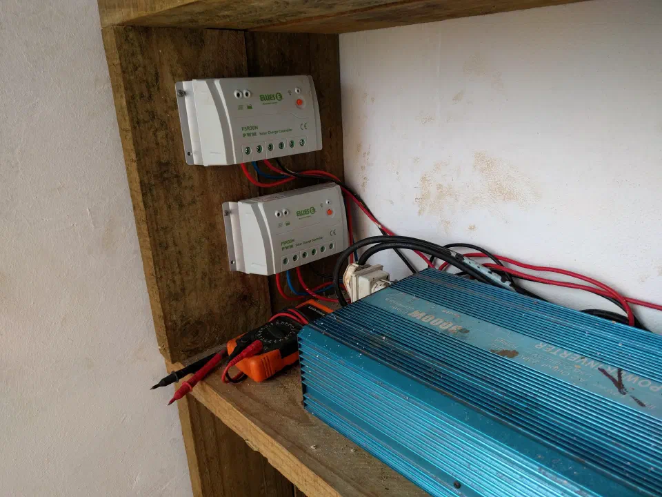 The charge controllers and inverter after installation